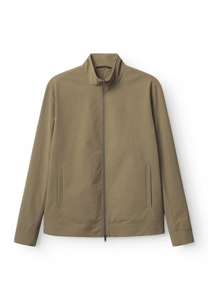 Khakijacke mit Stehkragen, Reißverschluss und zwei Seitentaschen. Glattes, leichtes Material mit minimalistischem Design.