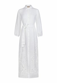 Vit linneklänning med långa ärmar, krage och ett knytbälte. Har broderade blommönster längs fållen och knäppning fram.