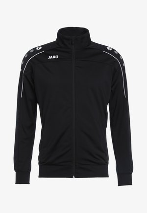 Zwarte trainingsjack met staande kraag, volledige rits, witte accenten en grijze cirkelvormige details op de schouders. Gemaakt van smooth, lichtgewicht materiaal.