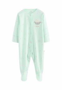 Grön babybody i mintfärg gjord av mjukt tyg, med små fårmönster och knappstängning framtill med en etikett som säger "lilla vän".