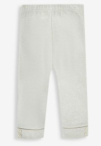 Pantaloni a coste grigio chiaro con vita elastica e polsini con bottone. Tessuto morbido con un motivo sottile, adatti per un abbigliamento casual.
