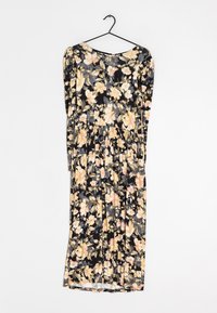 Robe midi noire avec manches longues, jupe plissée et motif floral jaune et rose suspendue à un cintre noir.
