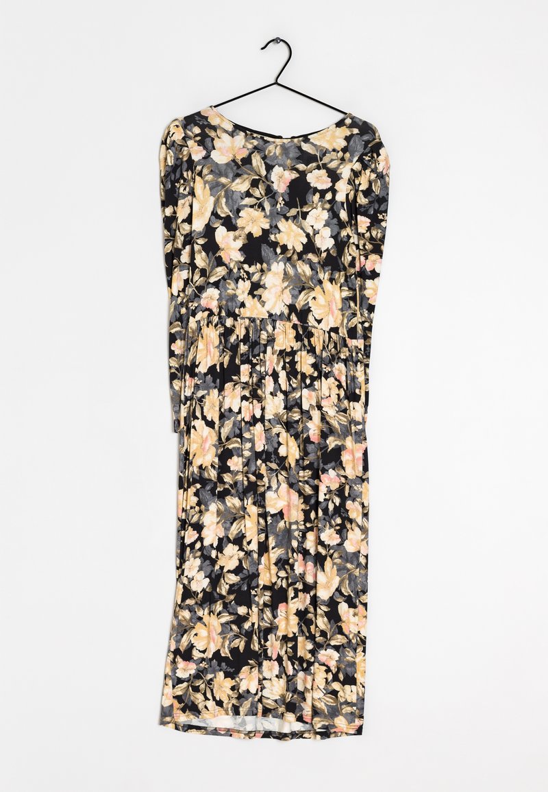 Black midi dress with long sleeves, pleated skirt, and yellow and pink floral pattern hanging on black hanger.