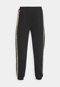 Černé tepláky s elastickými lemy u kotníků i v pase, s boční zlatou proužkovou logou "Calvin Klein Jeans." Měkká textura, volný střih.