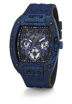 Guess chronograph watch features a blue textured silicone strap, black textured case, and three sub-dials on a gray dial background.