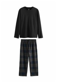 Maglietta a maniche lunghe nera abbinata a pantaloni del pigiama a scacchi blu navy e grigi con vita elasticizzata e cordino regolabile.