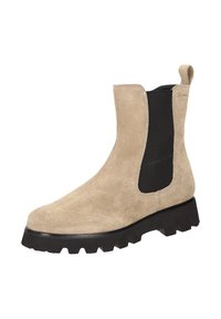 Beige Wildleder-Ankle-Boot mit schwarzen elastischen Seiten-Einsätzen, robuster Gummisohle und Zuglasche. Mit glatter Oberfläche und abgerundeter Zehenpartie.