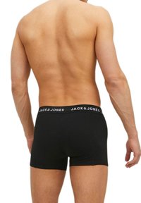 Boxer shorts neri in cotone con una morbida cintura elastica che presenta il nome del marchio "JACK & JONES" in lettere bianche, design aderente.