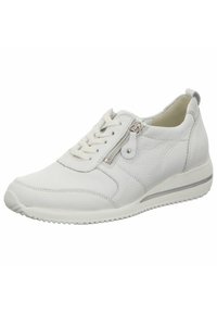 White leather sneakers with a textured finish, featuring a side zipper, laces, and a rubber sole with a subtle gray stripe.