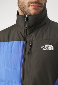 The North Face ACONCAGUA POCKET JACKET - Pūkinė striukė - solar blue/black