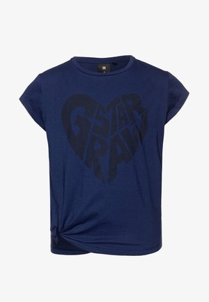 T-shirt bleu marine à manches courtes, avec un grand graphic en forme de cœur noir et le texte "G-Star RAW" en lettres majuscules. Détail noué au bas.