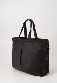Black nylon tote bag with two handles and a zippered side pocket, standing upright against a plain background.