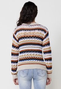 Knit sweater with horizontal stripes in brown, beige, blue, and white. Features an openwork design, ribbed cuffs, and waistband.