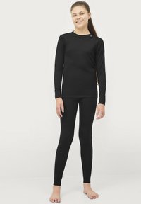 Zwarte langarmtop en leggings van gladde, elastische stof. Strak ontwerp met een ronde hals en polsmanchetten.