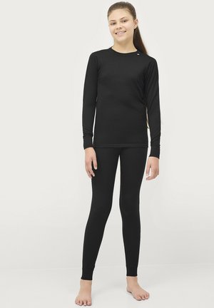 Sort langærmet top og leggings lavet af glat, strækbart stof. Tætsiddende design med rund hals og håndledsmanchetter.