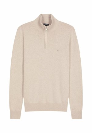 Pull zippé beige avec des manches longues, fabriqué en tissu tricoté. Doté d'un col haut et d'un ourlet côtelé. Petit logo sur la poitrine.