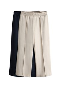 Kaks pükste paari: üks tumelilla ja teine beež. Mõlemal on elastne vöökoht ja sirge jala lõige, sileda kangaspinnaga.