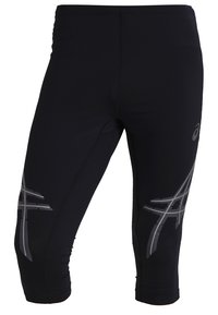 Pantalons capri de sport noirs en matériau extensible avec des accents gris réfléchissants et des motifs géométriques sur les côtés.