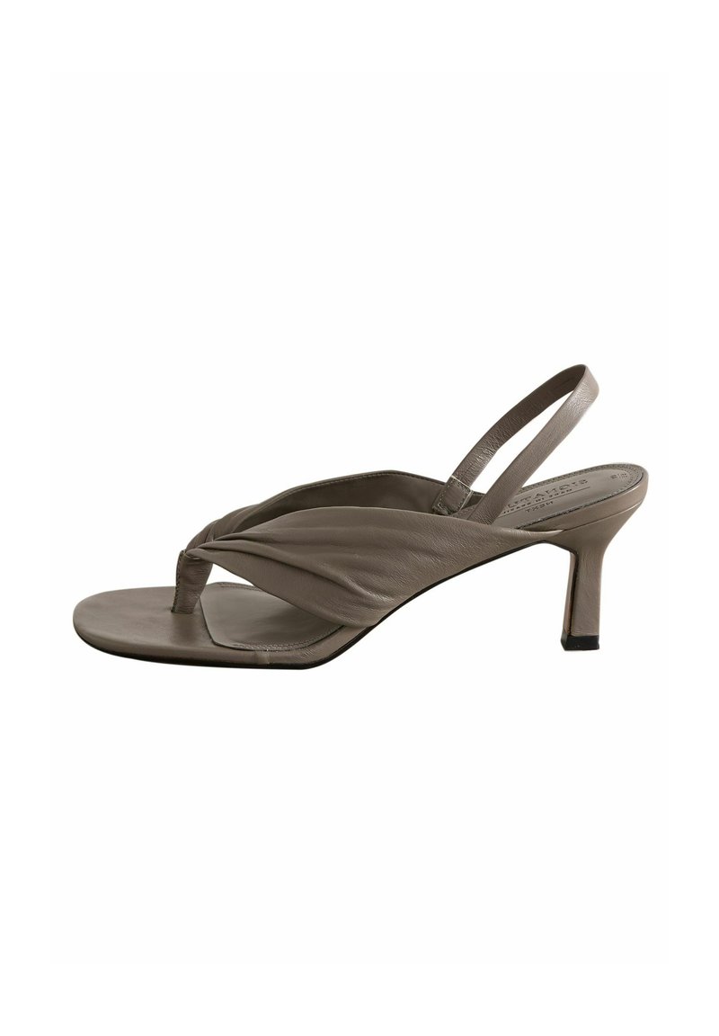 Light gray leather slingback sandal with a twisted front design, open toe, and a short, block heel. Smooth texture; minimalistic shape.