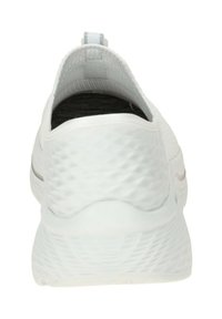 White athletic shoe with a textured, patterned heel, flexible upper, and a pull tab. Features a smooth sole with subtle accents.