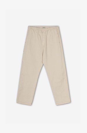 Beige Baumwollhose mit lockerer Passform, ausgestattet mit einem Kordelzugbund, seitlichen Taschen und einem dezent strukturierten Stoff.