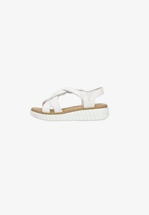 Białe skórzane sandały z krzyżującymi się paskami, otwartym noskiem i korkową wkładką. Podeszwa wykonana jest z biało-rubberowej gumy z rowkami.