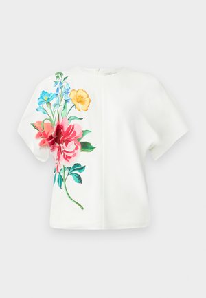 Top bianco a maniche corte con vivace stampa floreale in rosa, blu e arancione sul lato sinistro; tessuto liscio con una vestibilità comoda.