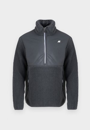 Dark gray fleece pullover with a half-zip collar, contrasting smooth chest panel, and textured sleeves, featuring a small logo on the chest.