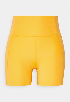 Girlfriend Collective RUN SHORTS - Legíny - golden glow