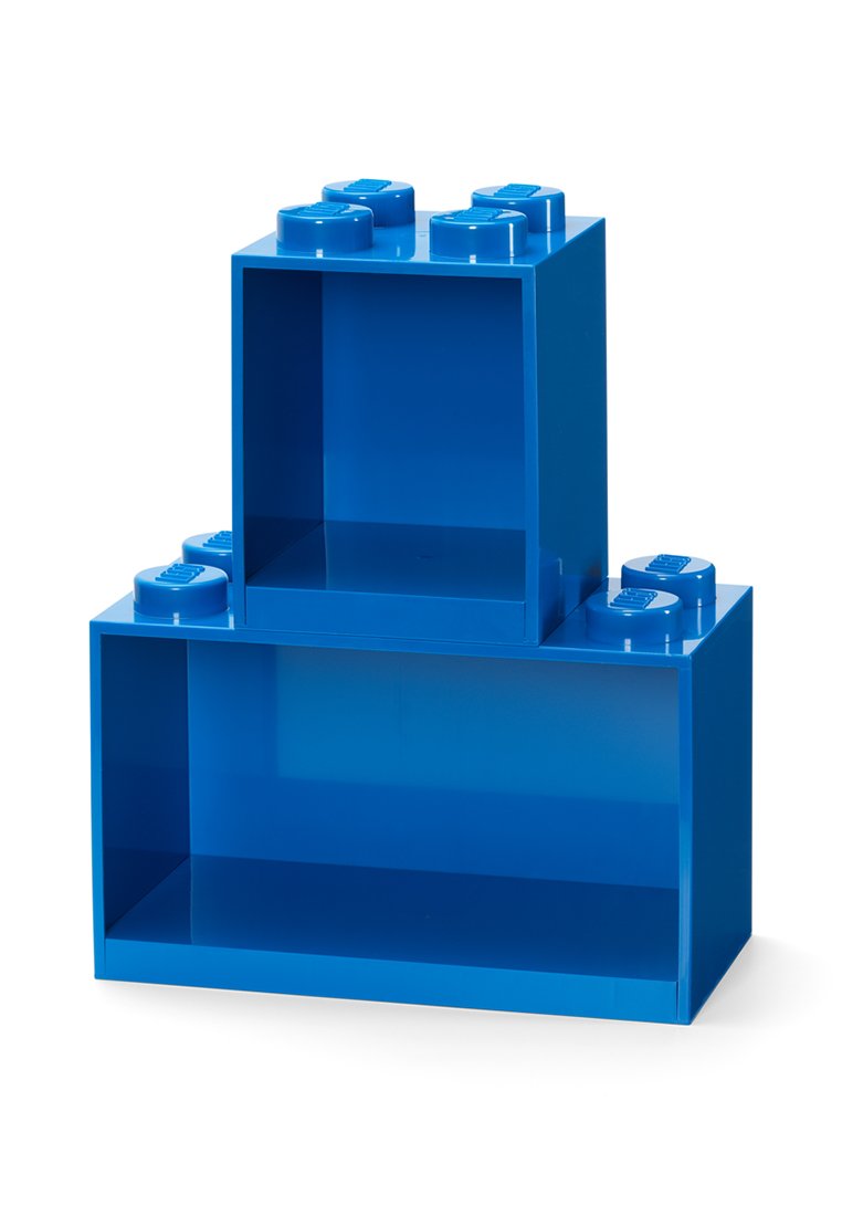 Dos bloques de almacenamiento de plástico azul apilados, con forma de grandes ladrillos de juguete interconectados, con interiores huecos.