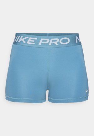 Modré sportovní šortky vyrobené z hladkého, elastického materiálu. Mají široký pas se světle modrým nápisem "NIKE PRO" a malým logem.