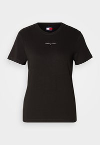 Svart bomull T-skjorte med rund hals og korte ermer. Forsiden viser en hvit "TOMMY JEANS"-logo med et lite farget aksent.