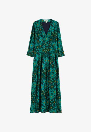 Duga, tirkizna haljina s dubokim V izrezom, dugim rukavima i cvjetnim uzorcima u žutoj i tamnozelenoj boji. Tkanina je glatka s lepršavim siluetom.