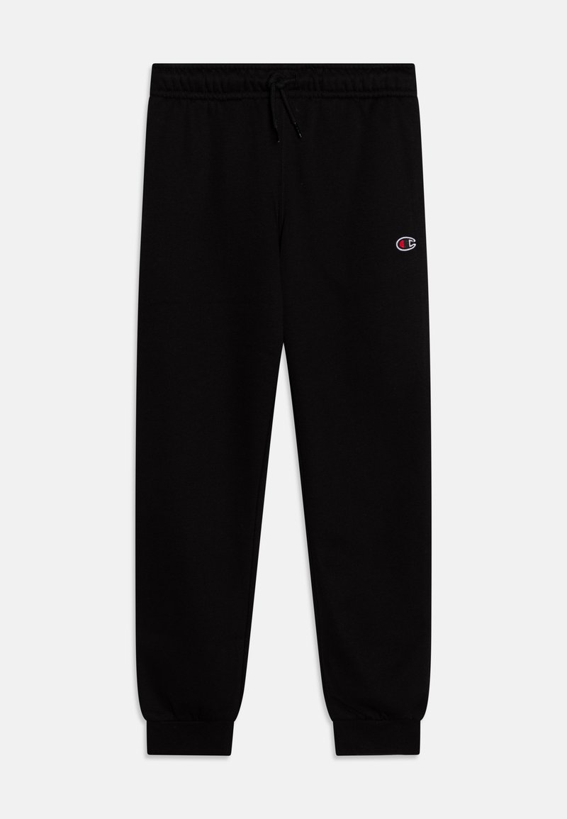 Pantalons de survêtement noirs avec taille élastique et poignets, détail de cordon de serrage et petit logo brodé sur la cuisse. Texture de tissu douce.