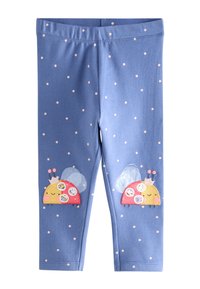 Leggings bleus à pois roses, avec des applications de coccinelles aux ailes et des éléments décoratifs sur le bas des jambes.