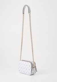 White rectangular bag with a subtle logo pattern, zip closure, and a gold-tone chain strap. Smooth material with a structured design.