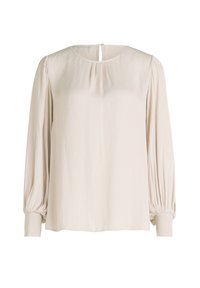Blusa beige chiaro con scollatura tonda, spalle arricciate e maniche lunghe a sbuffo. Presenta un tessuto morbido e una chiusura con bottoni sul retro.