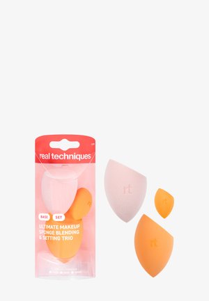 Three makeup blending sponges in pink and orange, including large, medium, and small sizes, with "rt" logo on each sponge.