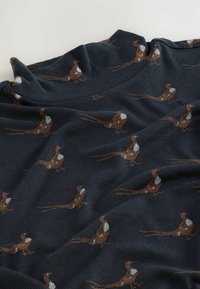 Dark blue knitted fabric featuring a pattern of brown and gray birds with white accents, showcasing a soft texture and relaxed drape.