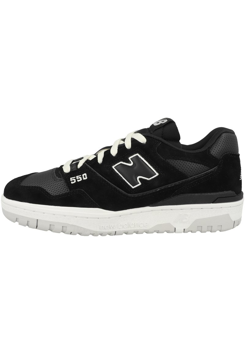 Black sneaker made of suede and leather, featuring a perforated design, white laces, and sole with tread, adorned with a large logo on the side.
