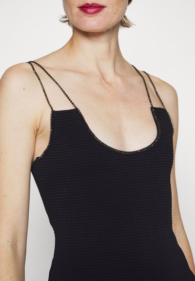 Must mustriga kleit õhukeste helmestega rihmadega ja kaelus sügava lõikega. Kangas on ribakujuline ning sobib keha ümber.