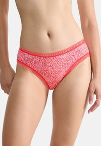 Red and white patterned bikini-style underwear with a lace trim around the waist and legs, featuring a smooth texture and fitted design.