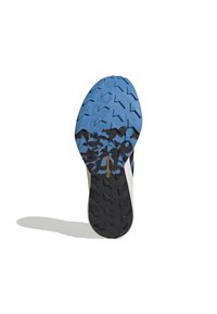 La suola della scarpa presenta una superficie in gomma blu con motivi di battistrada testurizzati, accenti neri di contrasto e un logo continentale in oro.