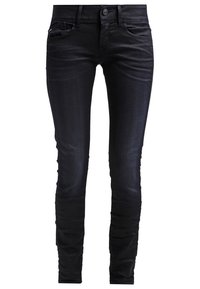 Svarta denim skinny jeans med en slät yta, standard femficksdesign och knäppning i midjan.