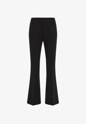 Black, flared trousers with a smooth texture. Features front and back pockets, tailored design, and a mid-rise waistband.