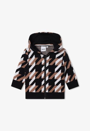 Veste bébé à capuche avec motif géométrique noir, blanc et marron, fermeture éclair devant et manches longues.