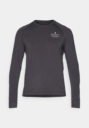 Langærmet mørkegrå skjorte lavet af blødt stof, med raglanærmer, en rund halsudskæring og et lille hvidt logo på brystet.