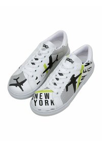White sneakers featuring black and green graphic designs, including text "NEW YORK," stripes, and airplane silhouettes. Rubber sole, lace-up.