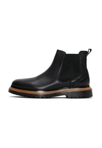 Botín Chelsea negro de cuero con acabado texturizado, paneles laterales elásticos y suela estratificada marrón. Presenta una suela de goma con patrón para mayor agarre.