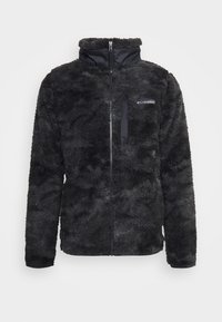 Giacca in pile nera con colletto alto, chiusura con zip e tasche laterali. Presenta un tessuto morbido e testurizzato e un piccolo logo sul petto.